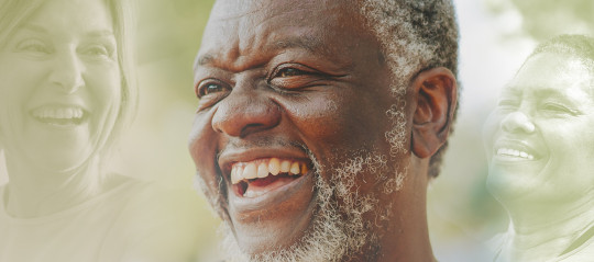 a man with white beard laughing