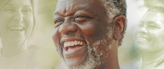 a man with white beard laughing